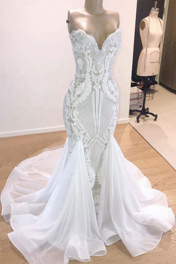 Try this Sparkle Mermaid White Wedding Dress to wow your wedding guests with stylesnuggle. The Strapless,Sweetheart design and exqusite handwork, and the Floor-length wedding dress with Appliques,Sequined to provide the cool and simple look for summer wedding.