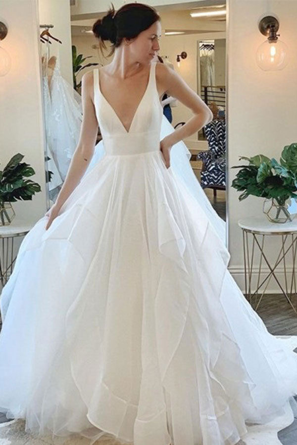 stylesnuggle offers Modern Deep V-neck Sleeveless White Tulle Wedding Dresses with Ruffless online at an affordable price from Tulle to A-line Floor-length skirts. Shop for Amazing Sleeveless collections for your bridal party.
