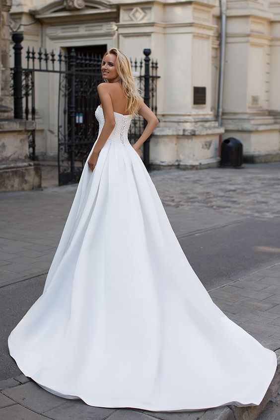 stylesnuggle custom made you this Simple Strapless White A-line Zipper up A-line Princess Wedding Dress comes in all sizes and colors.Fast delivery worldwide.