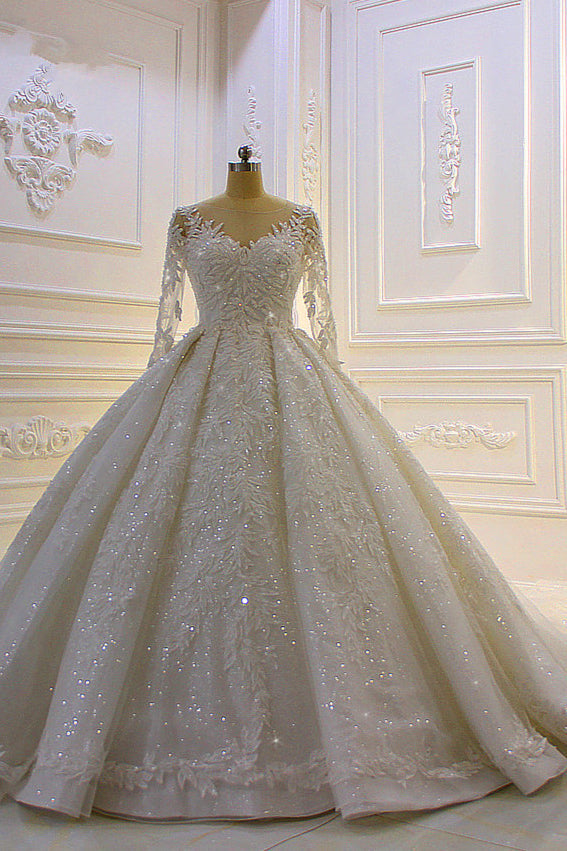 Finding a dress in Tulle, Ball Gown style, and delicate Lace,Beading,Appliques work? stylesnuggle custom made you this Sparkle 3D Lace Appliques Long Sleevess Church Train Wedding Dress at factory price.