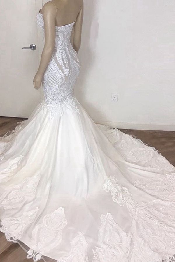 Try this Stunning Strapless Mermaid White Beach Wedding Dress to wow your wedding guests with stylesnuggle. The Strapless,Sweetheart design and exqusite handwork, and the Floor-length wedding dress with Lace,Appliques to provide the cool and simple look for summer wedding.