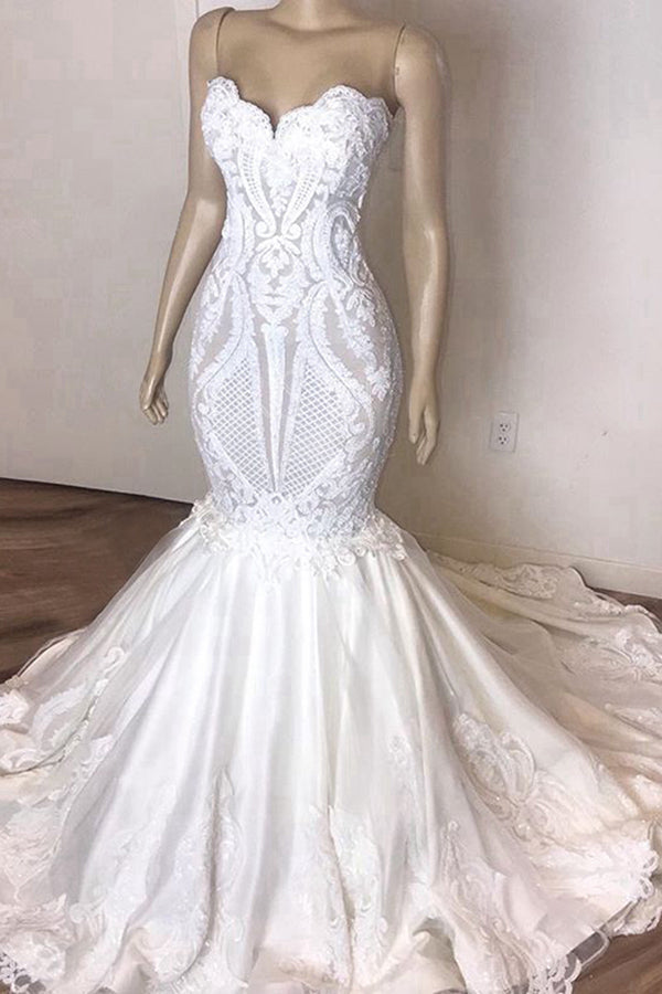 Try this Stunning Strapless Mermaid White Beach Wedding Dress to wow your wedding guests with stylesnuggle. The Strapless,Sweetheart design and exqusite handwork, and the Floor-length wedding dress with Lace,Appliques to provide the cool and simple look for summer wedding.